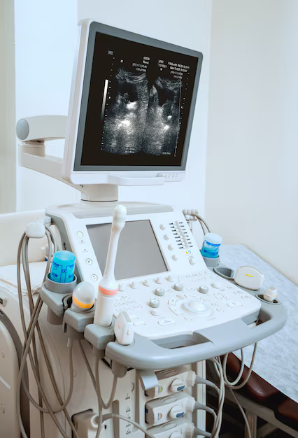 Ultrasound technician scanning patient in Sharjah diagnostic center Pregnancy ultrasound in Sharjah Thyroid ultrasound equipment IRC UAE Pediatric ultrasound Al Majaz Sharjah Breast ultrasound for lump – IRC UAE